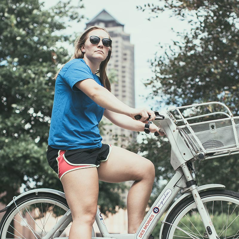 ϱ student riding a BCycle in downtown Des Moines